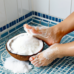Sugar & Coconut Oil Foot Scrub**

"A woman applying a sugar and coconut oil scrub to her feet in a bright, clean bathroom. Focus on the texture of the scrub and the healthy appearance of her feet. She is fully clothed in comfortable, modest attire. Safe for work, appropriate content, perfect anatomy, natural proportions, professional photography, high quality."

**